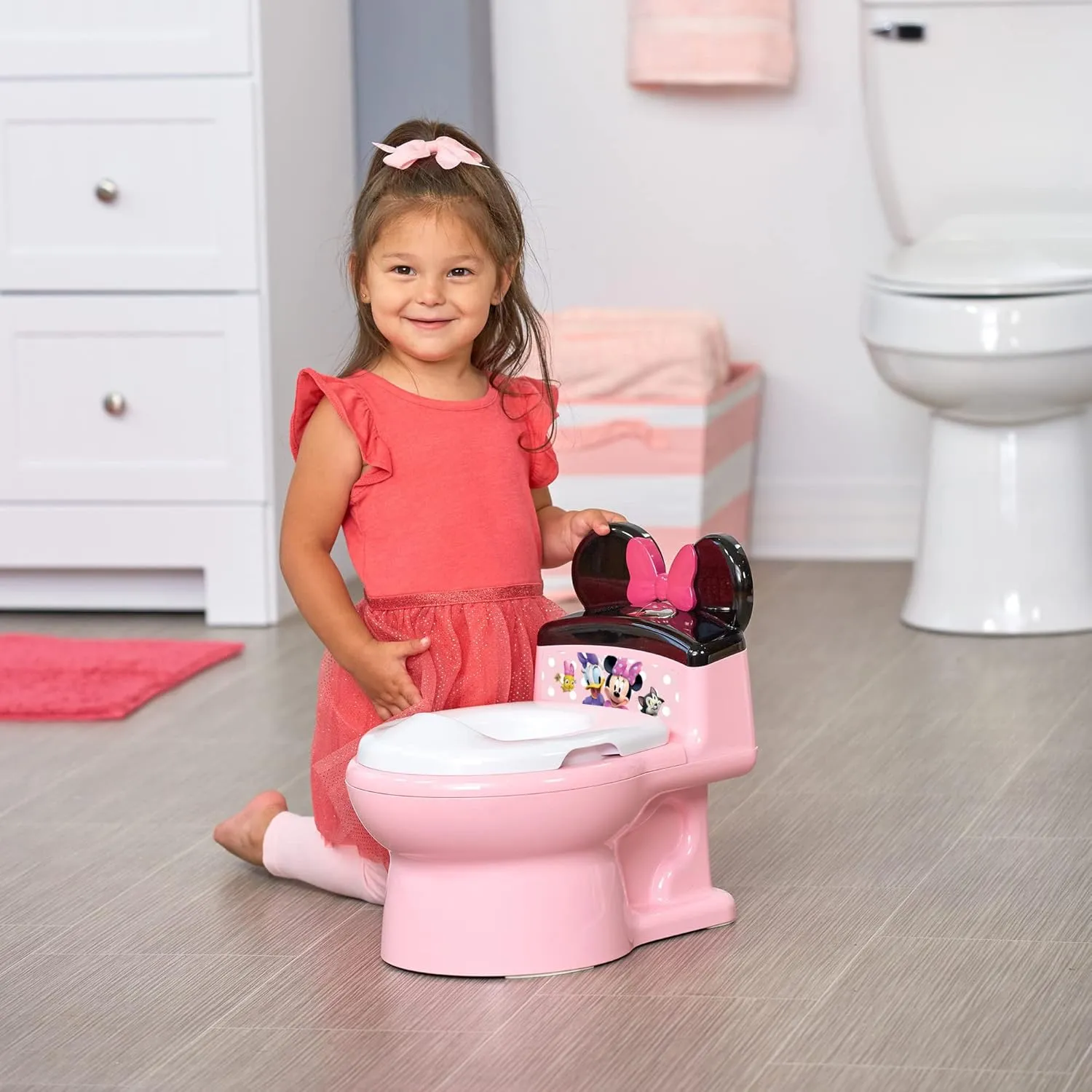 The First Years Disney Minnie Mouse Potty Training Toilet and Toddler Toilet Seat - Toilet Training Potty with Fun Flushing and Cheering Sounds,Pink